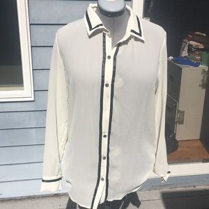 Ivory/black sheet blouse with rhinestone button.